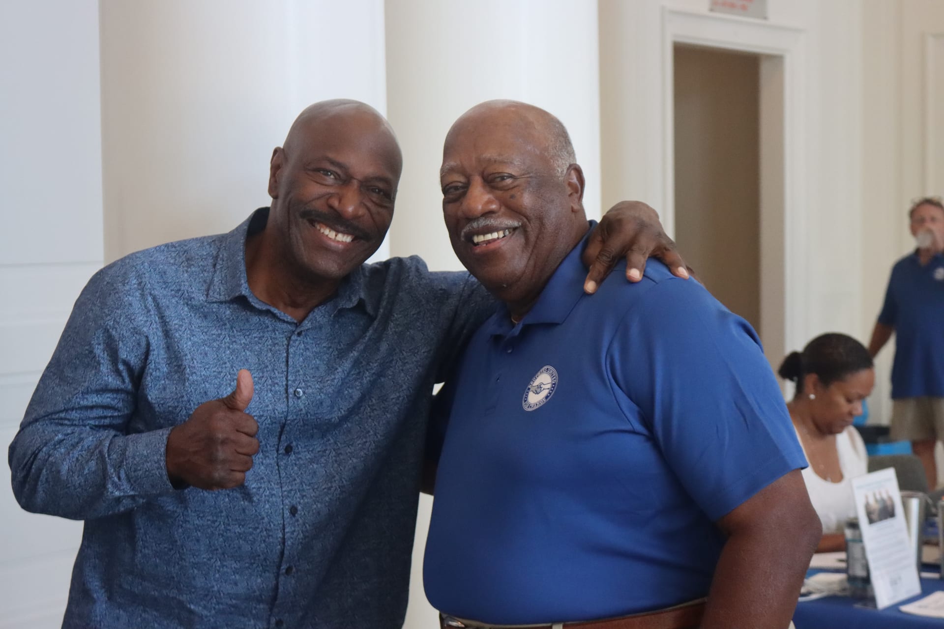 Two men smiling at BUFC conference