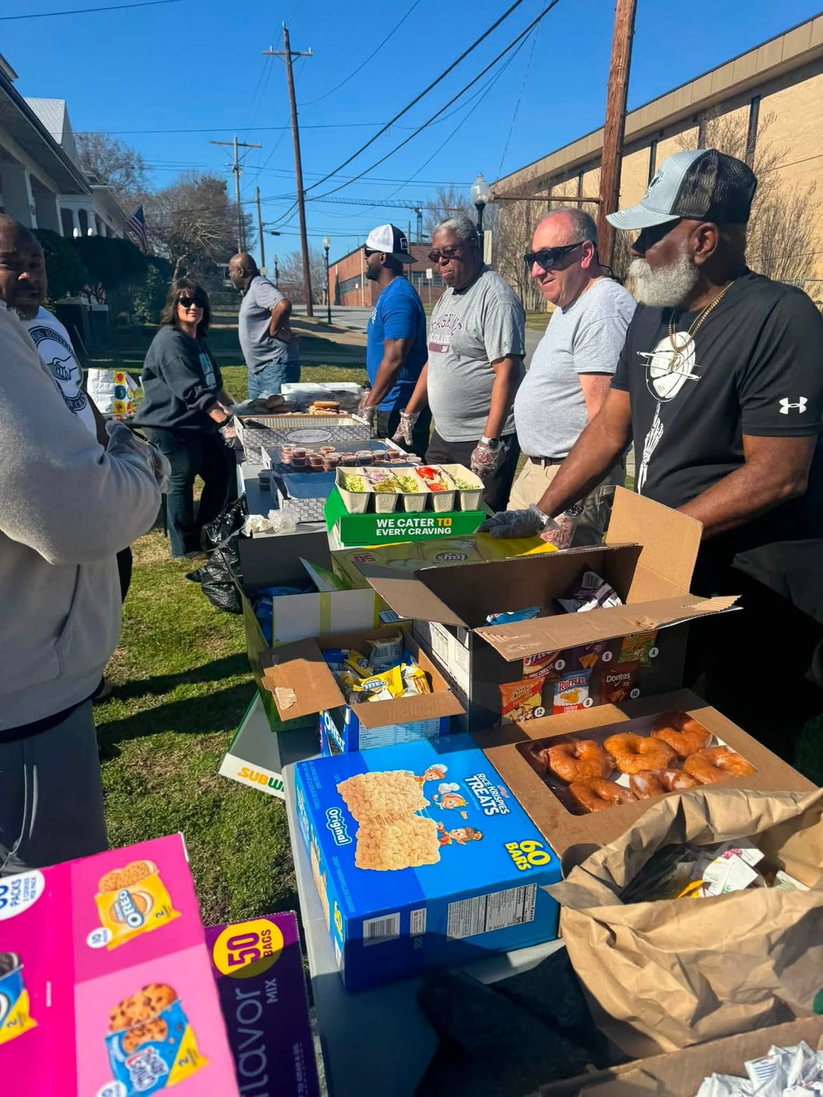 BUFC members at table for community event