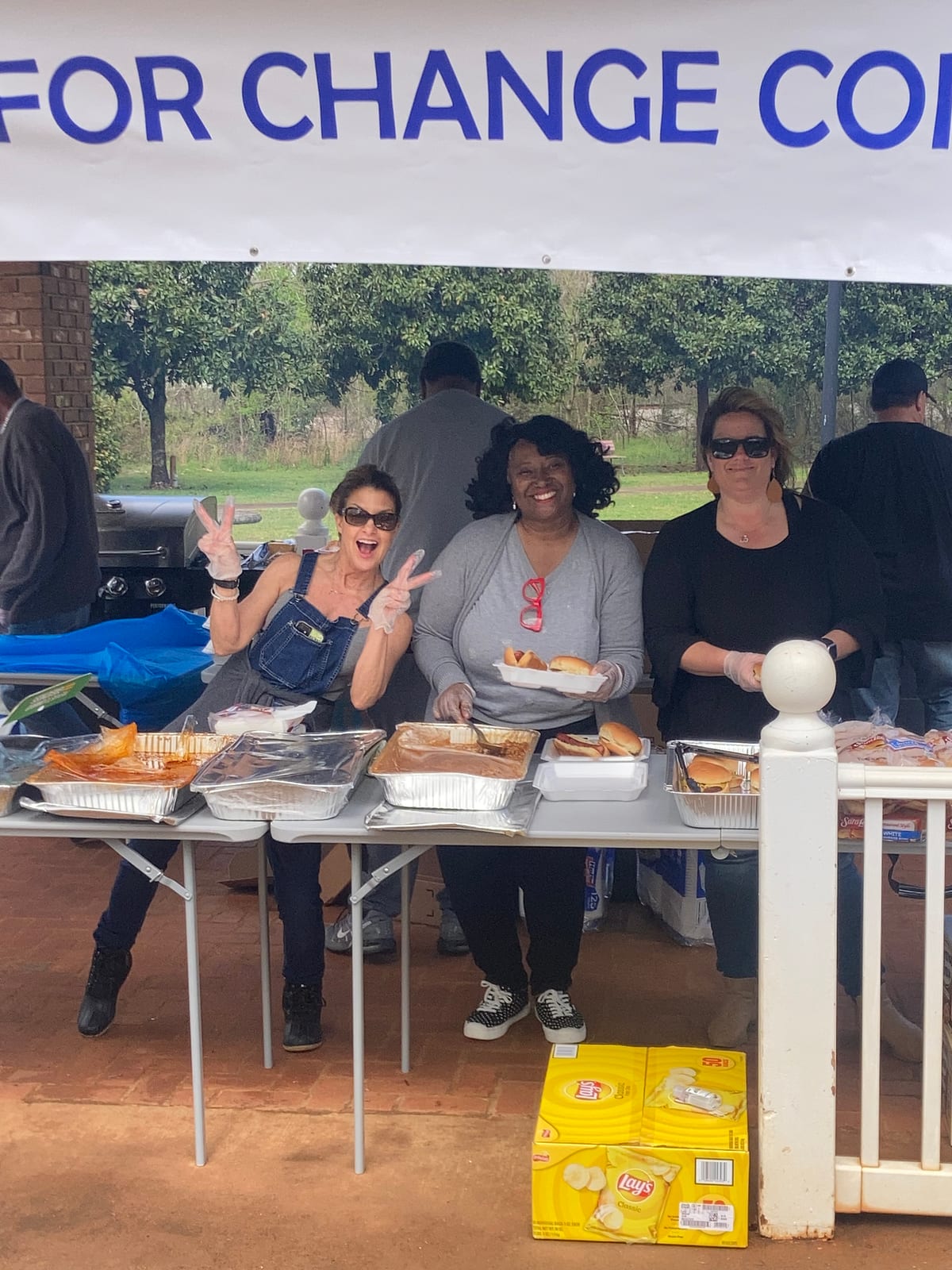 BUFC women volunteers serving at food table