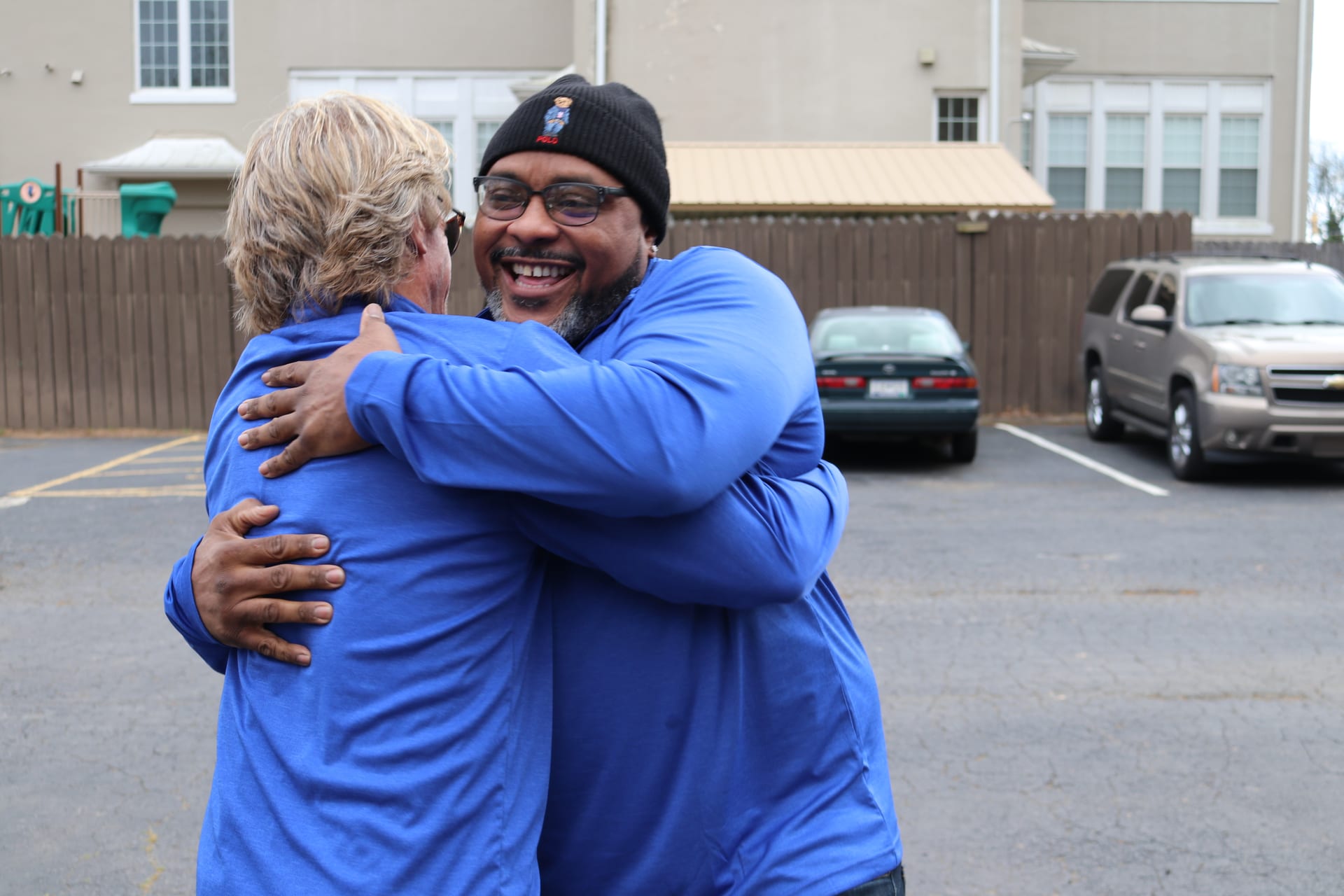 Brothers embracing at community event