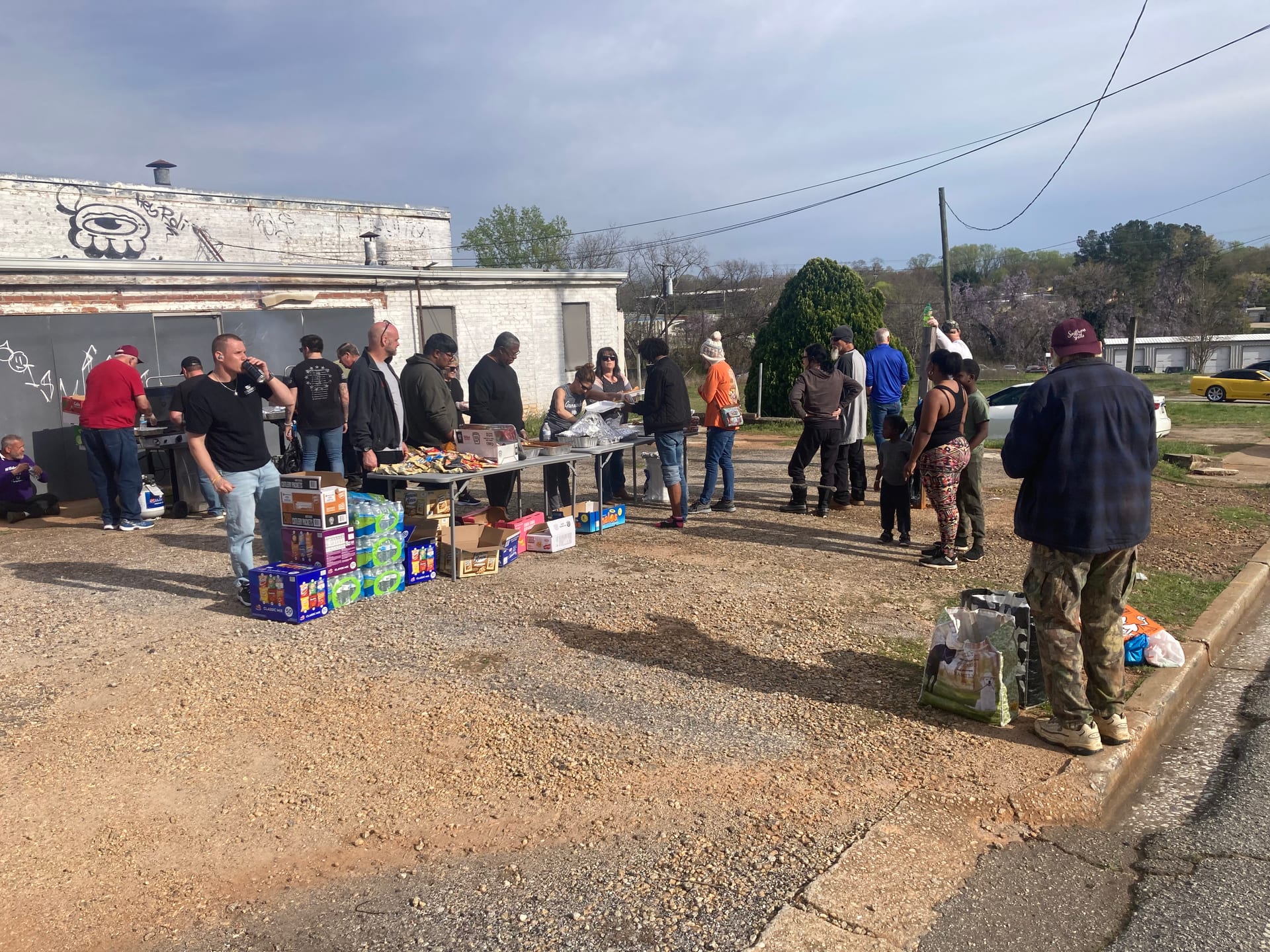 BUFC volunteers distributing food and supplies to the community